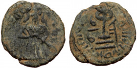 ISLAMIC, Umayyad Caliphate (Arab-Byzantine coinage).end of the C7th and beginning of the 8th century Æ Fals (Bronze, 19mm, 3.13g). 
Obv: Caliph stand...