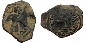 ISLAMIC, Umayyad Caliphate (Arab-Byzantine coinage).end of the C7th and beginning of the 8th century Æ Fals (Bronze, 24mm, 2.76g). 
Obv: Caliph stand...