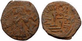 ISLAMIC, Umayyad Caliphate (Arab-Byzantine coinage).end of the C7th and beginning of the 8th century Æ Fals (Bronze, 20mm, 2.98g). 
Obv: Caliph stand...