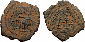 ISLAMIC, Umayyad Caliphate (Arab-Byzantine coinage).end of the C7th and beginning of the 8th century Æ Fals (Bronze, 23mm, 4.29g). 
Obv: Caliph stand...