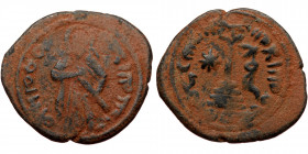 ISLAMIC, Umayyad Caliphate (Arab-Byzantine coinage).end of the C7th and beginning of the 8th century Æ Fals (Bronze, 24mm, 4.60g). 
Obv: Caliph stand...