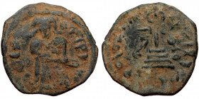 ISLAMIC, Umayyad Caliphate (Arab-Byzantine coinage).end of the C7th and beginning of the 8th century Æ Fals (Bronze, 20mm, 2.56g). 
Obv: Caliph stand...