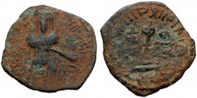ISLAMIC, Umayyad Caliphate (Arab-Byzantine coinage).end of the C7th and beginning of the 8th century Æ Fals (Bronze, 19mm, 2.56g). 
Obv: Caliph stand...