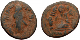ISLAMIC, Umayyad Caliphate (Arab-Byzantine coinage).end of the C7th and beginning of the 8th century Æ Fals (Bronze, 20mm, 3.05g). 
Obv: Caliph stand...
