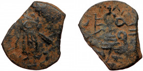 ISLAMIC, Umayyad Caliphate (Arab-Byzantine coinage).end of the C7th and beginning of the 8th century Æ Fals (Bronze, 20mm, 2.36g). 
Obv: Caliph stand...