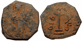 ISLAMIC, Umayyad Caliphate (Arab-Byzantine coinage).end of the C7th and beginning of the 8th century Æ Fals (Bronze, 19mm, 2.55g). 
Obv: Caliph stand...
