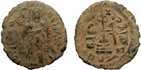 ISLAMIC, Umayyad Caliphate (Arab-Byzantine coinage).end of the C7th and beginning of the 8th century Æ Fals (Bronze, 22mm, 2.68g). 
Obv: Caliph stand...