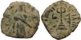 ISLAMIC, Umayyad Caliphate (Arab-Byzantine coinage).end of the C7th and beginning of the 8th century Æ Fals (Bronze, 19mm, 2.24g). 
Obv: Caliph stand...