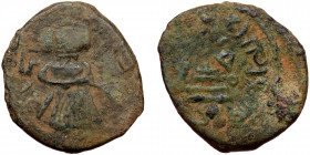 ISLAMIC, Umayyad Caliphate (Arab-Byzantine coinage).end of the C7th and beginning of the 8th century Æ Fals (Bronze, 19mm, 2.84g). 
Obv: Caliph stand...