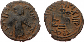 ISLAMIC, Umayyad Caliphate (Arab-Byzantine coinage).end of the C7th and beginning of the 8th century Æ Fals (Bronze, 20mm, 2.87g). 
Obv: Caliph stand...
