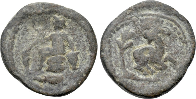 IONIA. Ephesus. PB Tessera (Circa 2nd-3rd centuries). 

Obv: Figure seated lef...