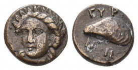 AEOLIS. Gryneion. (Circa 4th century BC). Ae.
Obv: Laureate head of Apollo facing slightly left.
Rev: ΓΥΡΝΗ.
Mussel shell.
SNG Ashmolean 1447-8.
Condi...