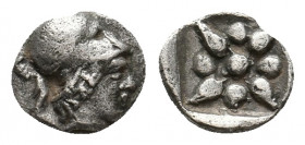 IONIA. Uncertain. (5th century BC). AR Hemiobol. 
Obv: Head right, with short hair, wearing Corinthian helmet 
Rev: Star of eight long rays in incuse ...