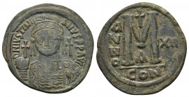 JUSTINIAN I (527-565 AD). AE, Follis. Nicomedia. Dated RY 12 (538/539).
Obv: D N IVSTINIANVS P P AVG. 
Helmeted, draped, and cuirassed bust facing, ho...