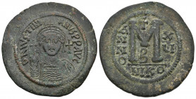 JUSTINIAN I (527-565 AD). AE, Follis or 40 nummi. Nicomedia. Dated RY 15 (541/2).
Obv: D N IVSTINIANVS P P AVG.
Helmeted and cuirassed bust facing, ho...