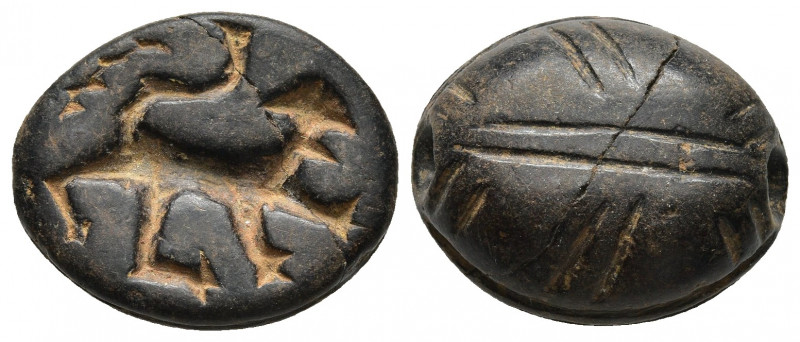 Greek, 1st – 9th Century BC.
Oval, black stone stamp-seal with domed top, in for...