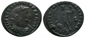 Licinius I AD 308-324. Siscia. Follis Æ. IMP LIC LICINIVS P F AVG, laureate head right / IOVI CONSERVATORI, Jupiter standing left, holding Victory on ...