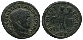 Maximinus II Æ Nummus. Antioch, AD 310-311. IMP C GAL VAL MAXIMINVS P F AVG, laureate head right / GENIO EXERCITVS, Genius standing left, holding corn...