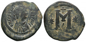 Justinian I. 527-565. AE Follis. Theoupolis (Antioch) mint. Struck 533-537. Diademed and draped bust right Rev: Large M; cross above, stars flanking, ...