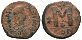 Anastasius I. 491-518. Æ Follis . Constantinople mint, Struck 507-512. Diademed, draped, and cuirassed bust right / Large M; cross above, stars flanki...