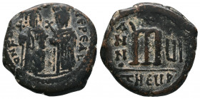 Phocas Æ 40 Nummi. Theoupolis (Antioch), Phocas and Leontia standing facing, holding globus cruciger and cruciform sceptre respectively; cross between...