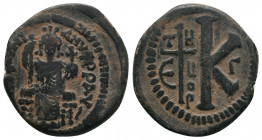JUSTINIAN I (527-565). Half Follis. Theoupolis (Antioch).
Obv: DN IVSTINIANVS PP AV.
Justinian enthroned facing, holding scepter and globus cruciger.
...