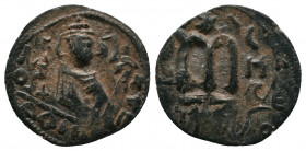 Umayyads, Arab-Byzantine Anonymous .
Abd al-Malik, 65-86 H./685-705 AD Follis
Obv: Imperial bust facing, to right the mint name in Arabic downwards an...