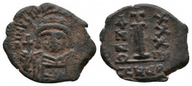 JUSTINIAN I (527-565). Decanummium. Antioch. Dated RY 34 .
Obv: D N IVSTINIANVS P P AV.
Helmeted and cuirassed bust facing, holding globus cruciger an...