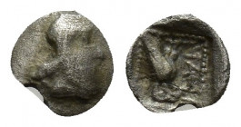 Asia Minor, uncertain AR Tetartemorion(?). 5th-4th centuries BC. (6mm, 0.2 g) Head of Persian Satrap right / Bird (Falcon?) standing left in dotted sq...