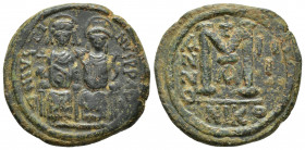 Justin II. 565-578. Æ Follis (30.2mm, 14.9 g). Nicomedia mint. Justin and Sophia, both nimbate, enthroned facing; Justin holding globus cruciger and S...