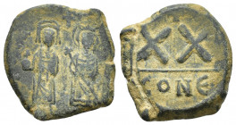 Phocas (602-610). Æ 20 Nummi (21.1mm, 6.2g,). Constantinopolis, 602/3. Full-length figures of Phocas and Leontia standing facing, holding globus cruci...