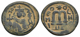 Arab-Byzantine, Umayyad Caliphate. AE follis 2.71gr gr. 21.8mm. Hims (Emesa) mint. Facing Umayyad Imperial bust / EMI to left of M,birds eye on either...