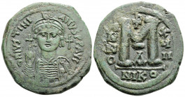 Byzantine
Justinian I (527-565 AD) Nicomedia
AE Follis (36.1mm, 20.6g)
Obv: D N IVSTINIANVS P P AVG. Helmeted and cuirassed bust facing, holding globu...
