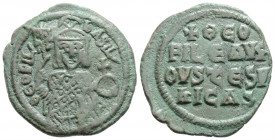 Byzantine 
Theophilus (829-842 AD) Constantinople
AE Follis (24.9mm, 5.5g)
Obv: ΘЄOFIL' ЬASIL'. Facing bust, holding labarum and globus cruciger, and ...