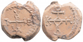 Byzantine Lead Seal ( 9th -10th centuries)
Obv: Cruciform monogram
Rev: Cruciform monogram
(15.6 g, 26.1 mm diameter)