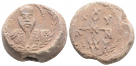 Byzantine Lead Seal ( 9th -10th centuries)
Obv: Facing bust of uncertain saint.
Rev: Cruciform monogram
(14.8 g, 22.4 mm diameter)