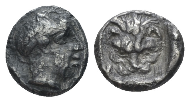 Bruttium, Rhegium Obol circa 356-351, AR 7.00 mm., 0.54 g.
Male head r. (Apollo...