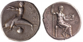 CALABRE, Tarente ( 450-425). Statère (8,10g) Phalentos assis sur un siège, tenant un sceptre et un canthare. R/ Taras sur le dauphin, bras tendus vers...
