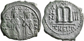 Phocas, 602-610. Follis (Bronze, 27 mm, 8.38 g, 5 h), with Leontia, Theoupolis (Antiochia), RY 3 = 604/5. O N FOCA NЄ PЄ AV Phocas, on the left, stand...