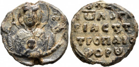 Johannes, logariastes of the Tropaiophoros (St. George), last third of 11th century. Seal (Lead, 20 mm, 6.81 g, 12 h). [MHP] - ΘV Nimbate bust of the ...