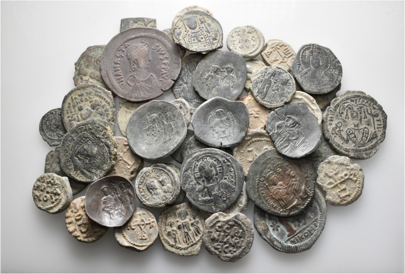 A lot containing 30 bronze coins and 16 lead seals. All: Byzantine. Fine to very...