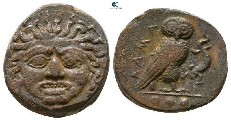 Sicily. Kamarina circa 420-405 BC. 
Tetras Æ

13mm., 3,01g.

Facing gorgone...