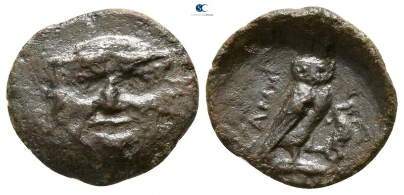 Sicily. Kamarina circa 420-405 BC. 
Onkia Æ

12mm., 0,89g.

Facing gorgonei...