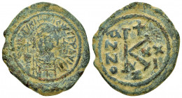 JUSTINIAN I.(527-565).Constantinople.Half Follis.

Obv : D N IVSTINIANVS P P AVG.
Diademed, helmeted, and cuirassed facing bust, holding globus crucig...