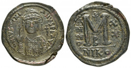 JUSTINIAN I.(527-565).Nicomedia.Follis.

Obv : DN IVSTINIANVS PP AVG.
Helmeted, cuirassed bust facing, holding cross on globe and shield with horseman...