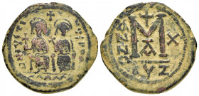 JUSTIN II with SOPHIA.(565-578).Cyzicus.Follis. 

Obv : D N IVSTINVS P P AVG.
Justin, holding globus cruciger, and Sophia, holding cruciform scepter, ...