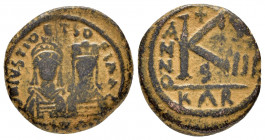 JUSTIN II with SOPHIA.(565-578).Carthage.Half Follis.

Obv : Facing busts of Justin, helmeted and cuirassed, and Sophia, crowned and draped; cross bet...