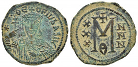 THEOPHILUS.(829-842).Constantinople.Ae.

Obv : ✷ • ΘЄOFIL ЬASIL.
Crowned facing bust, holding cross potent and akakia .

Rev : Large M; X/X/X to left,...