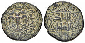 ARTUQID.Nasir al-Din Mahmud (1200-1222 AD).Amid.Dirham. 

Obv : Double-headed eagle with wings displayed; all within quadrilobe; legend around.

Rev :...
