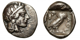 Attica, Athens.
AR Drachm
4,16 g / 16 mm
~ 454-404 BCE
Helmeted head of Athena right, with frontal eye / Owl standing right, head facing, closed t...